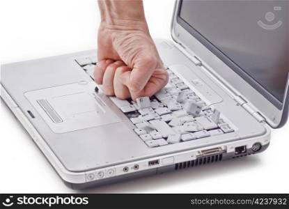 By hand damaged laptop keyboard on white background