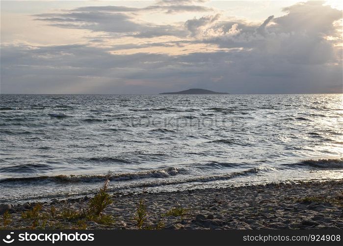 By the coast of the Baltic Sea with an island in the background from the island Oland