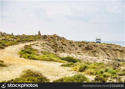 C&er car c&ing on cliff, spanish landscape along Almeria coast. Traveling with motorhome.. C&er c&on cliff, coast in Spain