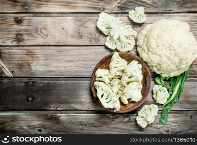 Cabbage in basket. On a wooden background.. Cabbage in basket.