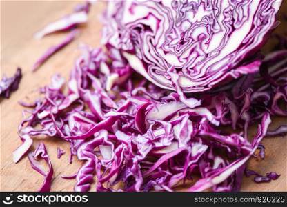 Cabbage purple / Shredded red cabbage slice in a wooden cutting board