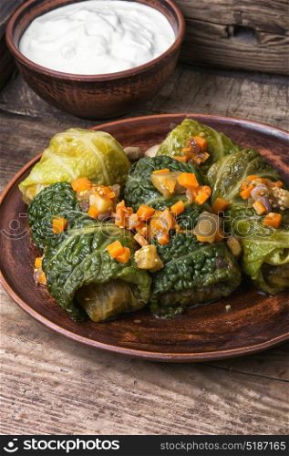 Cabbage rolls stuffed vegetable,. Ukrainian vegetable dietary cabbage rolls in leaf of savoy cabbage