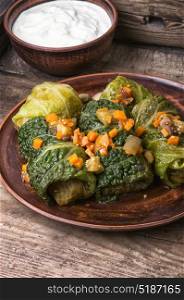 Cabbage rolls stuffed vegetable,. Ukrainian vegetable dietary cabbage rolls in leaf of savoy cabbage