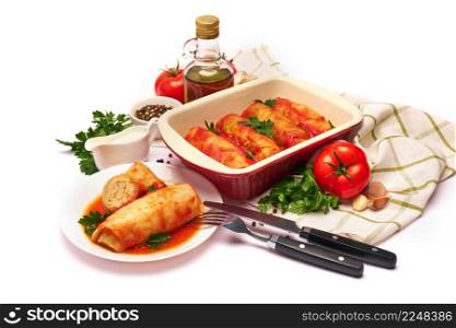 cabbage rolls stuffed with ground beef and rice with sour cream in a baking dish and ingredients. High quality photo. cabbage rolls stuffed with ground beef and rice with sour cream in a baking dish and ingredients