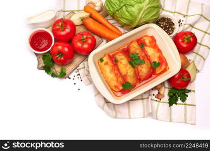 cabbage rolls stuffed with ground beef and rice with sour cream in a baking dish and ingredients. High quality photo. cabbage rolls stuffed with ground beef and rice with sour cream in a baking dish and ingredients