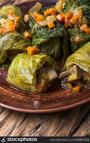 cabbage rolls with vegetable. Ukrainian vegetable dietary cabbage rolls in leaf of savoy cabbage