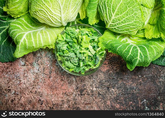 Cabbage salad in a glass bowl. On rustic background.. Cabbage salad in a glass bowl.