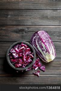 Cabbage salad in the bowl. On a wooden background.. Cabbage salad in the bowl.