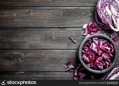 Cabbage salad in the bowl. On a wooden background.. Cabbage salad in the bowl.
