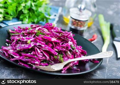 cabbage salad on plate and on a table