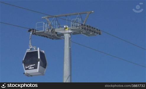 Cable car going to Alps ski resort