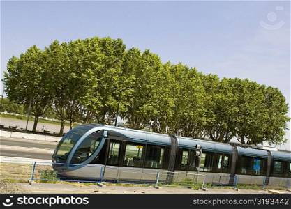 Cable car on tracks with a river in the background, Garonne River, Bordeaux, France