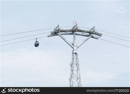 Cable car on wire. transport over island transit. Cloud backgruond in season summer.