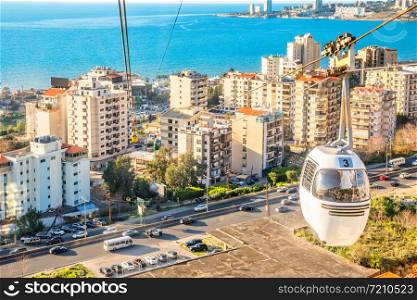 Cable car over the residence district with blue sea in the background, Jounieh, Keserwan District,, Lebanon