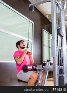 Cable Lat pulldown machine man workout at gym exercise