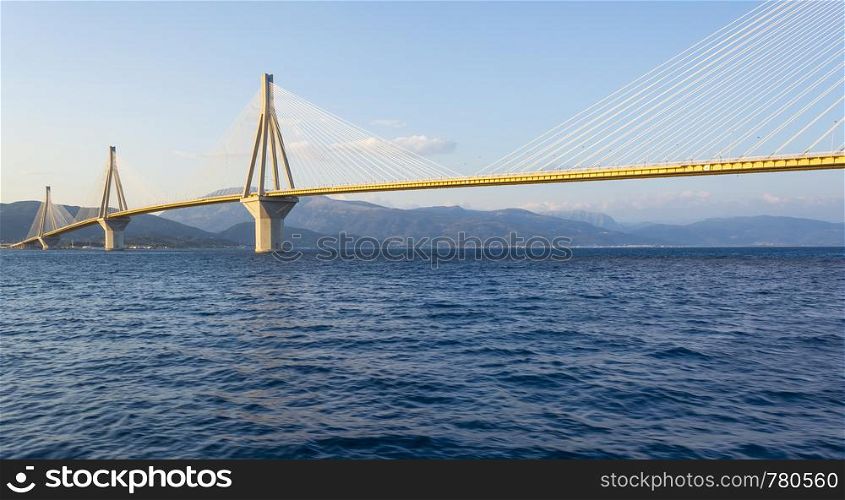 Cable-stayed suspension bridge crossing Corinth Gulf strait, Greece. It is one of the world's longest multi-span cable-stayed bridges and the longest of the fully suspended type. Cable-stayed suspension bridge crossing Corinth Gulf strait, Greece