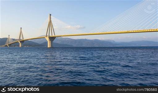 Cable-stayed suspension bridge crossing Corinth Gulf strait, Greece. It is one of the world's longest multi-span cable-stayed bridges and the longest of the fully suspended type. Cable-stayed suspension bridge crossing Corinth Gulf strait, Greece