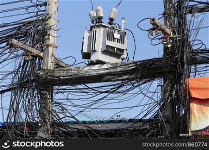 Cable wires on the electric poles are tangled,Messy signal line for design in your work concept.