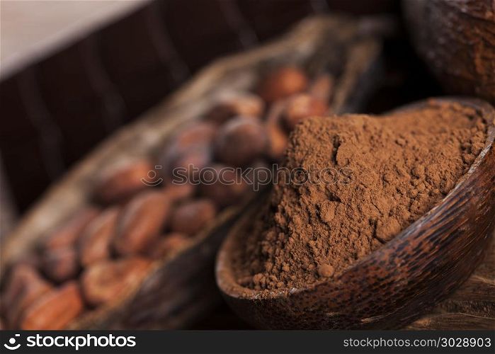 Cacao beans and powder and food dessert background. Aromatic cocoa, powder and food dessert background