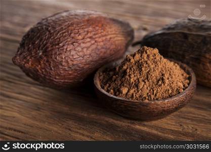 Cacao beans and powder and food dessert background. Aromatic cocoa, powder and food dessert background