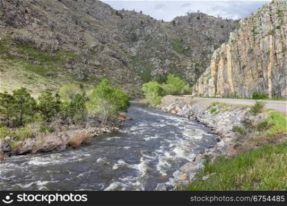 Cache la Poudre RIver and highway in canyon west of Fort Collins, Colorado, springtime flow
