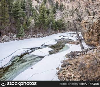 Cache la Poudre River at Big Narrows west of Fort Collins in northern Colorado - winter scenery with a partially frozen river