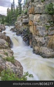 Cache la Poudre River at Poudre Falls in northern Colorado, , early summer scenery with a high flow
