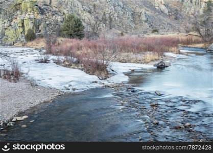 Cache la Poudre River in winter scenery at confluence with its North Fork , Gateway Natural Area near Fort Collins, Colorado