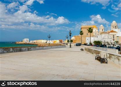 Cadiz. City embankment.. Stone Town Quay with lanterns along the Atlantic Ocean. Cadiz. Spain. Andalusia.
