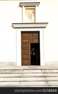 cadrezzate abstract rusty brass brown knocker in a door curch closed wood italy lombardy