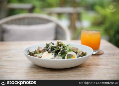 caesar salad appetizer on wooden background