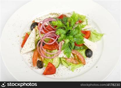 Caesar salad dish close up on a white background