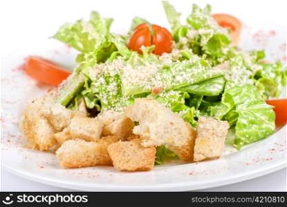 Caesar salad dish closeup isolated on a white background