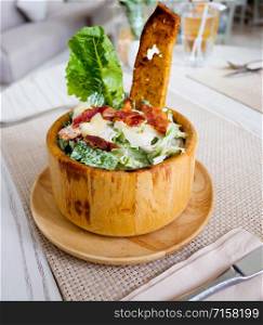 caesar salad on table in restaurant