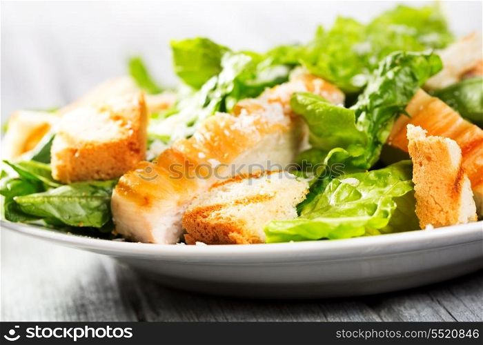 Caesar salad on wooden table