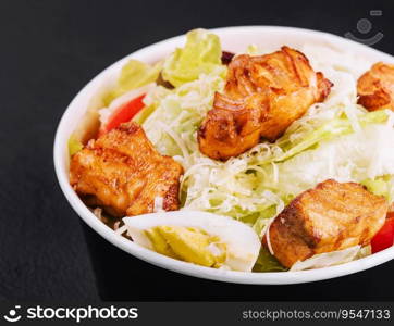 Caesar salad with chicken fillet and parmesan cheese