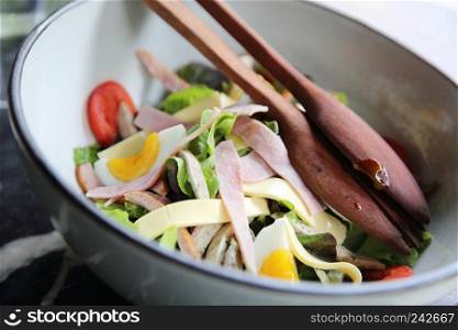 caesar salad with ham and eggs