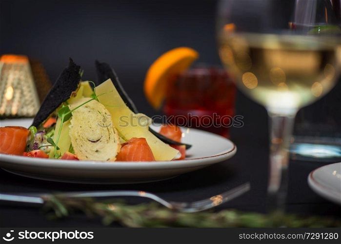 Caesar salad with salmon fish. Tasty restaurant dish. Caesar salad with salmon fish