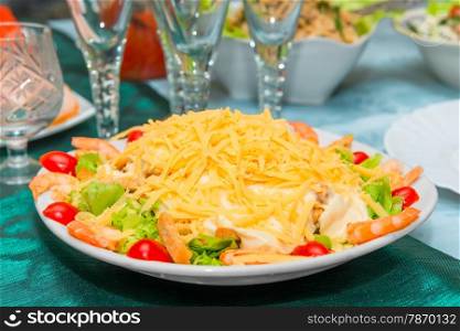 Caesar salad with shrimps in a plate