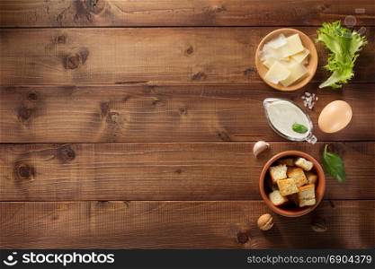caesar sauce ingredients at wooden background