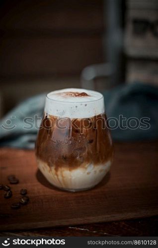 Cafe latte macchiato layered coffee in a see through glass coffee cup. . Cafe latte macchiato layered coffee