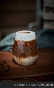 Cafe latte macchiato layered coffee in a see through glass coffee cup. . Cafe latte macchiato layered coffee