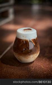Cafe latte macchiato layered coffee in a see through glass coffee cup.
. Cafe latte macchiato layered coffee