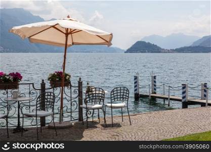 Cafe on promenade in Menaggio, Como lake, Italy