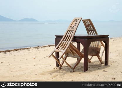 Cafe on tropical beach at sunset