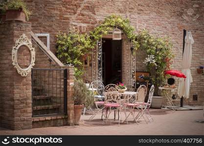 cafe. Small patio. tables and chairs at the city, Italy, Certaldot. Tuscany, Italy