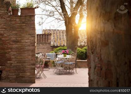 cafe. Small patio. tables and chairs at the city, Italy, Certaldot. Tuscany, Italy
