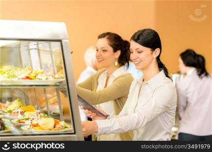 Cafeteria lunch young woman take salad plate fresh food canteen
