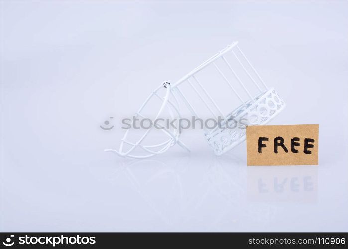 Cage, retro styled key and the word help on white background
