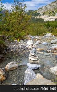 Cairn on a river in Vanoise national Park valley, Savoy, French alps. Cairn on a river in Vanoise national Park valley, French alps